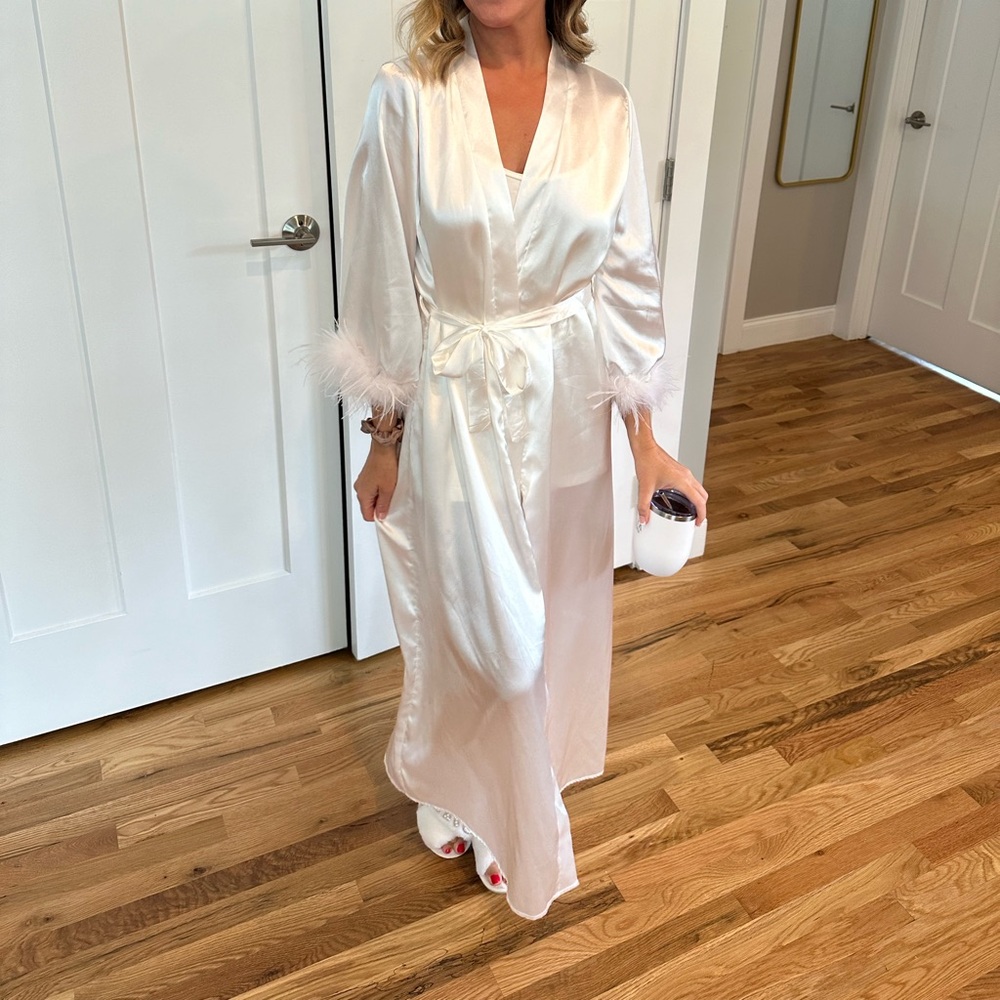 White satin bridal robe with ostrich feather trim